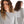 Nahaufnahme: Frau und Mann in grauem oversized veercrew T-Shirt 